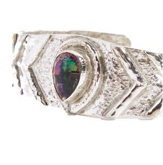 Inspired by ancient Egyptian fashion, this one of our most popular pieces due to the sacred design and uniqueness held in this powerful bangle. Mystic topaz is the main focal point of this bangle, used to connect to your spiritual self and align with the energies of the universe. All of The World Of INDAH gems are designed by Coco Effendi, handcrafted in Indonesia by our talented team of artisans using traditional techniques & tools from recycled brass. Each item is carefully dipped in 24k gold Sterling Silver Fusion Bracelets, Adjustable Sterling Silver Fusion Bracelets, Artisan Bangle Jewelry For Festivals, Festival Fusion Bangle Jewelry, Silver Fusion Bracelets For Festivals, Silver Fusion Style Bracelets For Festival, Fusion Style Silver Bracelets For Festival, Unique Festival Bracelet, Unique Festival Bracelet Jewelry