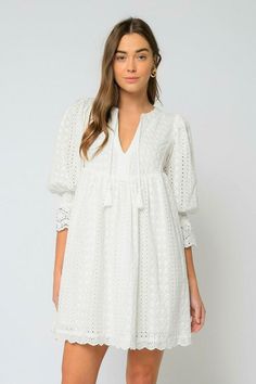 White Lace Puff Sleeve Dress For Spring, White Lace Puff Sleeve Dress With Lace Trim, White Puff Sleeve Mini Dress With Lace Trim, White Long Sleeve Eyelet Dress, Casual White Dresses With Tassel Ties, Casual White Dress With Tassel Ties, White Crochet Trim Dress For Spring, White Long Sleeve Dress With Crochet Trim, White Mini Dress With Crochet Trim For Brunch