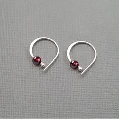 Small everyday sleeper hoops in Sterling silver .925 or Fine pure silver .999. With 3 mm accent bead in sterling silver or 14k goldfilled or 4 mm amethyst, garnet or black onyx. Also available with no bead. Hoops are approx. 5/8" or 9 mm. Hammered on rounded side for comfort and a bit of sparkle.  Comfortable enough to sleep in. Insert by gently opening to sides and then closing again once inserted. Instructions and alcohol swab are provided with each order.  Unisex.  Choose your earring metal; Handmade Sterling Silver Huggie Earrings As Gift, Sterling Silver Round Huggie Earrings For Gifts, Silver Huggie Earrings With Birthstone, Adjustable Sterling Silver Huggie Earrings Gift, Handmade Silver Huggie Earrings For Gift, Handmade Silver Huggie Earrings As Gift, Nickel-free Sterling Silver Huggie Earrings As Gift, Handmade Sterling Silver Huggie Earrings For Anniversary, Sterling Silver Huggie Earrings Perfect For Gifts