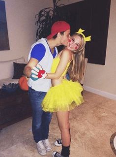 two people dressed up as pokemon and princesses kissing each other in the living room