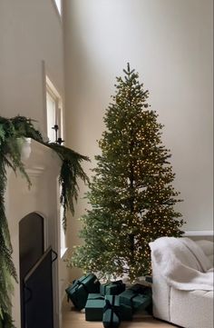 a living room with a christmas tree and presents on the floor