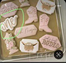 decorated cookies in the shape of cowgirl boots and cowboy boots with names on them