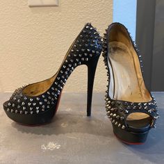 Brand: Christian Louboutin Black Leather Spiked Lady Peep Toe Platform Pumps (Vintage & Rare) The Original Louboutin Spikes Size: Eu 38.5 Us 8 Color: Black Leather With Silver Metal Hardware (Spikes) Condition: Vintage/Heavy Wear (Zero Spikes Missing) Have Been Re-Soled Material: Metal And Leather Leather Lining (Re-Soled Red Bottom Ball Of The Foot In Red Rubber/ Made It Easier For Me To Not Slip While Working In These) *Notes* If You Lived In New York In The 2009-2012's These Were Everything/ Hard To Get Your Hands On, I Purchased These In Soho At The Louboutin Store So I Can Work In Them At The Box, And Greenhouse. Designer Studded Open Toe Heels, Designer Open Toe Heels With Studs, Studded Fitted Heels For Formal Occasions, Formal Studded Open Heel Shoes, Formal Studded Open Heel Heels, Formal Studded Fitted Heels, Formal Open Heel Studded Heels, Formal Heels With Studs And Open Heel, Formal Fitted Studded Heels