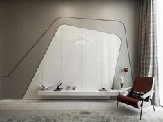 a room with a chair and a large mirror on the wall