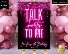 a sign that says talk forty to me surrounded by balloons and streamers in pink