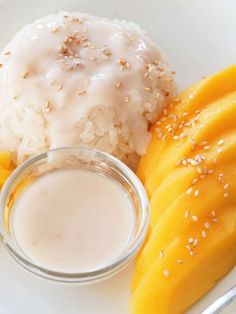 a white plate topped with rice and fruit