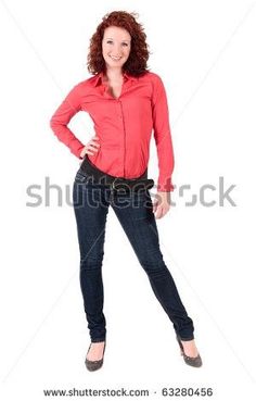 woman in red shirt and jeans posing for the camera with her hands on her hips