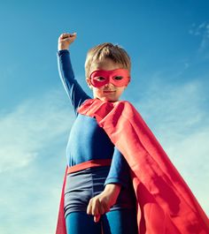 a young boy dressed as a super hero