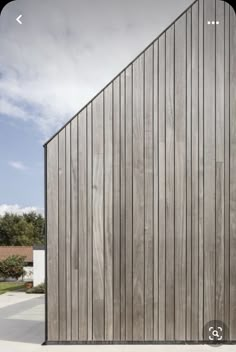 the side of a building with wooden slats on it