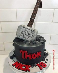 a birthday cake with a hammer on top