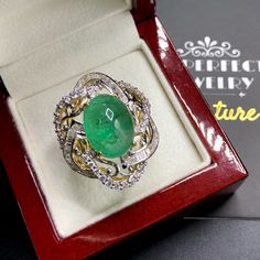 "ENJOY OUR WORRY-FREE SERVICE AND THE DAZZLING, GENUINE JEWELRY WE DESIGN AND HANDCRAFT WITH LOVE❤️ ABOUT THE ITEM: This ring is the perfect combination of elegance, beauty, and INVESTMENT VALUE! With a TRANSPARENT, Cabochon 12.08 carats, VIVID FOREST GREEN emerald, and 83 extremely sparkling diamonds. The ring was deliberately designed and handcrafted by our boutique's in-house goldsmiths. You will love this gorgeous piece as much we do. And people will absolute adore it once they see the spark Luxury Emerald Ring With Oval Cabochon And 17 Jewels, Luxury Oval Cabochon Emerald Ring With 17 Jewels, Luxury Emerald Cabochon Ring With Diamonds, Luxury Oval Cabochon Emerald Ring, Fine Jewelry Emerald Diamond Cabochon Ring, Luxury Cabochon Diamond Ring As Gift, Fine Jewelry White Gold Emerald Cabochon Ring, Fine Jewelry White Gold Cabochon Emerald Ring, White Gold Cabochon Emerald Ring Fine Jewelry