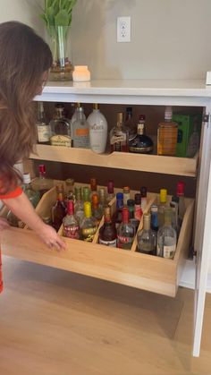 a kitchen counter with the words check out this custom bar storage on it's side