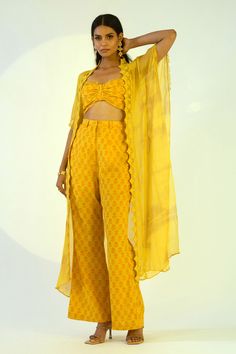 Yellow tube top with floral printed motifs. Paired with pant and shrug.
Component: 3
Pattern: Printed
Type Of Work: Floral motifs
Neckline: Top: Sweetheart, Shrug: Open
Sleeve Type: Top: Sleeveless, Shrug: Short
Fabric: Chiffon,cotton
Color: Yellow
Other Details: 
Floral printed motifs
Pleated bodice
Sheer shrug
Lace detailing
Belt loop detailing
Occasion: Cocktail - Aza Fashions Shrug Dresses Indian, Summer Fitted Pant Set With Dupatta, Fitted Summer Pant Set With Dupatta, Fitted Bollywood Pant Set With Printed Motifs, Fitted Sets With Dupatta And Straight Pants, Fitted Pant Set With Printed Motifs For Summer, Fitted Summer Pant Set With Printed Motifs, Summer Fitted Pant Set With Printed Motifs, Fitted Sets With Straight Pants And Dupatta