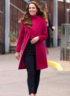 the duke smiles as she walks down the street