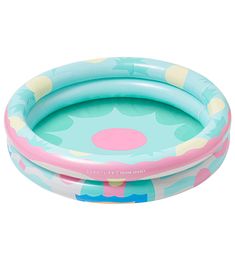 an inflatable swimming pool with flowers on the bottom and pink, blue, yellow and