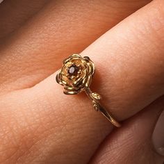 January Carnation Birth Flower Ring Material: Choose from Solid 14k Yellow Gold, 14k White Gold, 14k Rose Gold, or 925 Sterling Silver. Stone: 2 mm genuine AA grade brilliant cut Band: Solid 1.3 round band Carnation Flower: Garnet Ring Carnation meaning varies depending on the flower color. But at its heart, basic carnation flower meaning embraces the ideas of fascination, distinction, and love. The love aspect of carnation meaning includes everything from a mother's devoted love to a suitor's p Carnation Flower Meaning, Carnation Birth Flower, January Carnation, Garnet Birthstone, Flower Meanings, Stamped Rings, Carnation Flower, Garnet Ring, Birth Flower