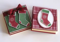 two cards with christmas stockings on them, one has a red ribbon and the other is green