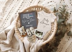 a basket filled with baby items on top of a blanket