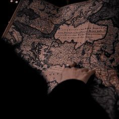 a person looking at a map in the dark