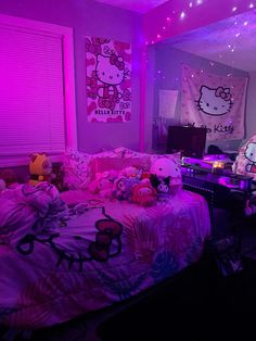 a bedroom with hello kitty bedding and pink lights