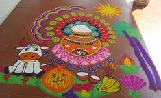 the floor is decorated with colorful designs and animals on it's side, along with pumpkins