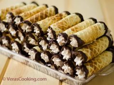 chocolate covered crepes are arranged in a tray