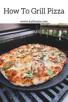 a large pizza sitting on top of a grill