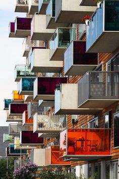 an apartment building with balconies and colorful balconies