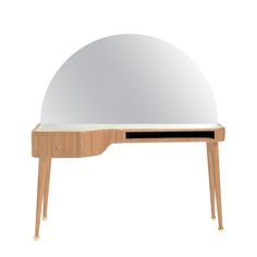 an oval shaped mirror on top of a wooden table with a drawer underneath it and a shelf below the mirror