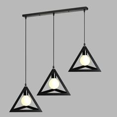 three lights that are hanging from a light fixture in the shape of triangulars and triangles