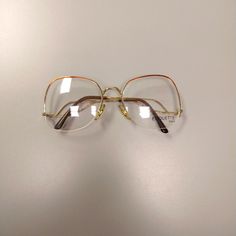 Semi Rimless, Gold And Bronze Metal Eyeglasses. Vintage 80s. Style Is Very Unique. Curved Design Temples. Adjustable Nose Pads. Demo Lenses Are Not Meant To Be Worn, May Have Scratches (Only Used For Demonstration Purposes In Retail) Made In Italy. New, Old Stock. Made By Etiquette. Model F170 Eye Width 54mm Eye Height 50mm Bridge 16mm Temple Length 135mm Physical Manifestation, Fashion Thoughts, 80s Glasses, Metal Eyeglasses, 80s Style, Curve Design, Bronze Metal, Vintage Glasses, Cool Stuff