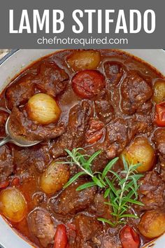 beef stew with potatoes and tomatoes in a white bowl