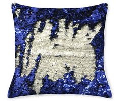 a blue and white pillow with sequins on it