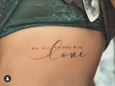 a woman's stomach with the words do all things with love written on it