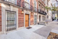 an apartment building with brick walls and balconies