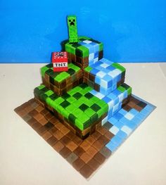 a cake made to look like an image of a green and blue minecraft creeper