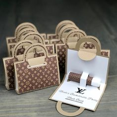 several brown and white paper bags sitting next to each other on top of a table