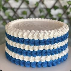 a blue and white cake on a plate