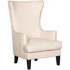 an upholstered chair with studding on the arms and back, in white linen