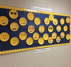 a bulletin board with yellow smiley faces on it