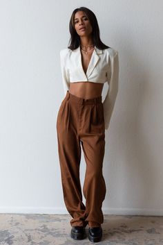 Meet your new fav pant for any season! Timeless and trendy are the Giselle Trouser featuring a loose fit with front pleat detail, side pockets and high waist. Color: Brown Loose Fit Front Pleats Pockets Wide Leg Mid Rise 100% Tencel Model is 5'7", size 25 in bottoms and is wearing size small Trendy Harem Pants With Loosely Fitted Hips For Work, Chic High Waist Relaxed Fit Cargo Pants, Chic Relaxed Fit Cargo Pants For Work, Trendy Harem Pants With Pockets For Workwear, Chic Loose-fit Cargo Pants For Fall, Chic Fall Cargo Pants With Loosely Fitted Hips, Chic Loosely Fitted Cargo Pants For Fall, Chic Harem Pants With Pockets For Day Out, Chic Tapered Leg Cargo Pants With Pockets