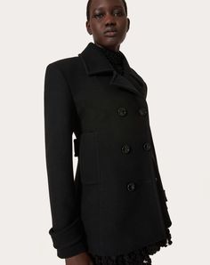 Compact Coat Peacoat - Double-breasted - Shoulder pads - Front closure with varnished buttons - Compact Coat (100% Virgin Wool) - Saglia Gino lining - Length: 74.5 cm / 29.3 in. from the shoulders in an Italian size 40 - Sleeve length: 83 cm / 32.7 in. from the centre back in an Italian size 40 - The model is 176 cm / 5'9"tall and wears an Italian size 40 - Made in Italy The look of the model is completed by Valentino Garavani Shoes. Designer Fitted Pea Coat With Double-breasted Buttons, Evening Double-breasted Outerwear With Double Button Closure, Designer Fitted Double-breasted Pea Coat, Luxury Double-breasted Outerwear For Evening, Designer Double-breasted Evening Outerwear, Luxury Double-breasted Evening Outerwear, Luxury Fitted Pea Coat With Button Closure, Designer Evening Outerwear With Concealed Placket, Business Double-breasted Outerwear With Covered Buttons