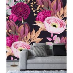 a floral wallpaper with pink flowers and green leaves in the background is an elegant living room