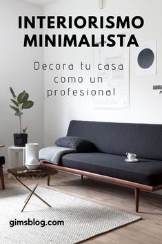 a living room with a black couch and white rug in front of the wall that says interiorismo minimalistaa