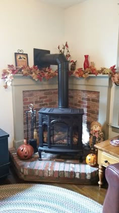 a living room filled with furniture and a fire place in the middle of the room