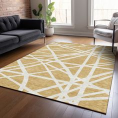 a living room with a couch, chair and rug