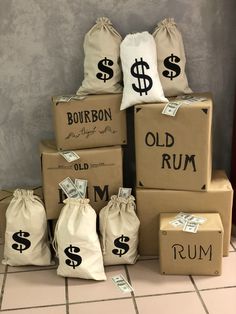 several bags with money are stacked on top of each other in front of a wall