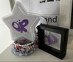 a star shaped object sitting on top of a table next to a box with beads