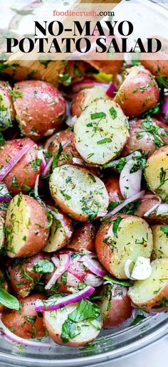 a bowl filled with potatoes, onions and herbs