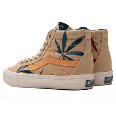 Inspired by the annual 4/20 holiday, the Sk8-Hi VR3 LX ‘Positive Vibration’ celebrates the day’s traditions. The cotton canvas upper is treated with embroidered marijuana leaves across the sides, while the signature padded collars add optimal comfort to the aesthetic. The iconic high foxing tape makes a statement along with the classic Vans branding seen at the woven tongue label and rubber heel. The ECOCUSH footbed adds additional comfort, while the vulcanized midsole and gum rubber waffle outs Unique Vans, Platform Dr Martens, Customization Ideas, New Rock Boots, Vans Vault, Shoe Wishlist, Classic Vans, Cool Vans, Reaction Face